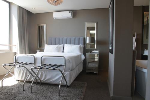 Ένα ή περισσότερα κρεβάτια σε δωμάτιο στο The Residences at Crystal Towers