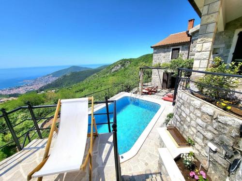 a villa with a swimming pool on a balcony at Villa Nera in Budva