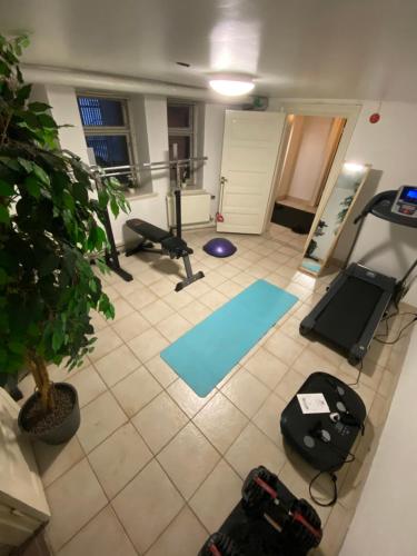 an overhead view of a room with a gym with exercise equipment at Grand Hôtel Mölle in Mölle