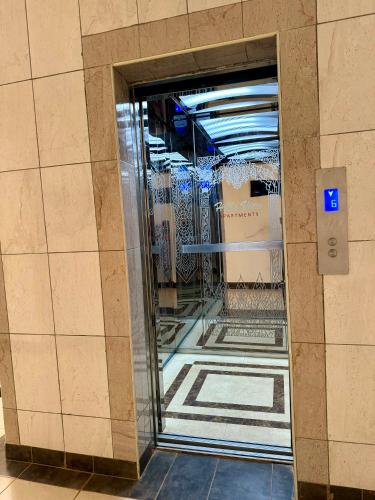 a glass door in a hallway in a building at Hillsview Apartment in Voi