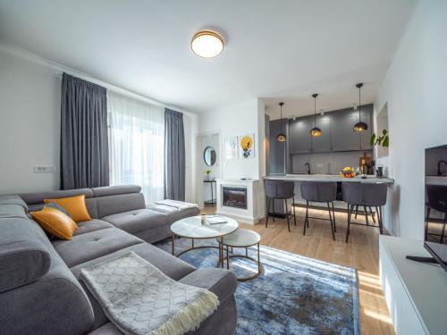 a living room with a couch and a piano at Holiday Home Jelena by Interhome in Klanfari