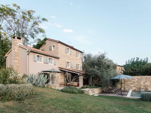 an external view of a house with a garden at San Canzian Hotel & Residences - Small Luxury Hotels of the World in Buje