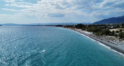 an aerial view of a beach with buildings and trees at Downtown Central Suite with Private Parking in Kalamata