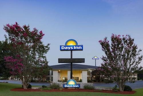 a sign for days inn in front of a building at Days Inn by Wyndham Spartanburg Waccamaw in Southern Shops