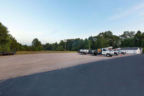 a white truck parked in a parking lot at Days Inn by Wyndham Savannah in Savannah