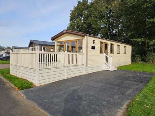 a large white house with a lot of windows at KMH Caravans at Flamingo Land in Kirby Misperton