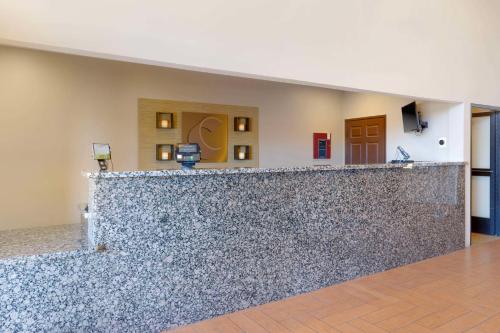 a lobby with a stone counter top in a building at Comfort Inn Near Grand Canyon in Williams
