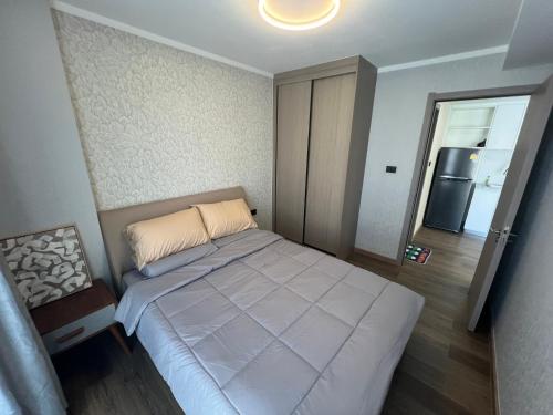 Ένα ή περισσότερα κρεβάτια σε δωμάτιο στο The One Chiang Mai Condo