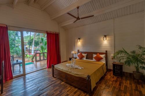 Tempat tidur dalam kamar di The Exotica Agonda