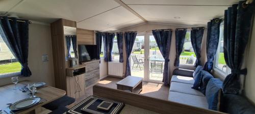 a view of a living room in a rv at KMH Caravans at Flamingo Land in Kirby Misperton
