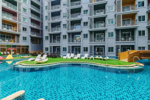 an image of a swimming pool at a apartment complex at Bauman Residence in Patong Beach