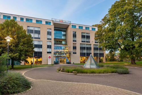 a building with a tent in front of it at Vienna House Easy by Wyndham Wuppertal in Wuppertal