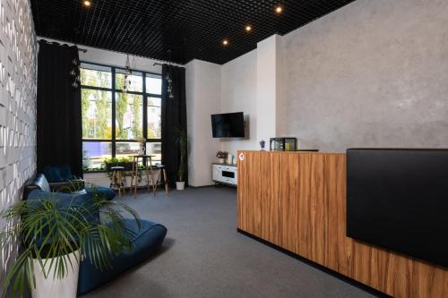 an office with a reception desk and a tv at Nyvky Residence in Kyiv