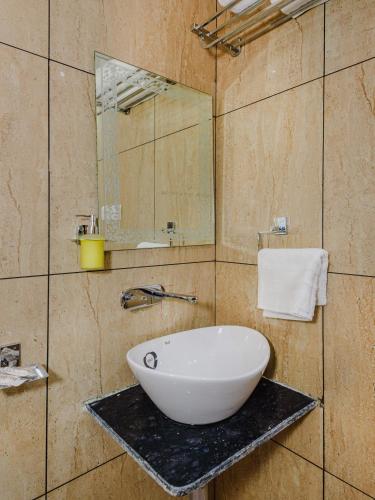 a bathroom with a white bowl sink on a counter at Hotel Zillion Executive Near US Consulate Bandra Kurla Complex Mumbai Near Mumbai Airport Mumbai in Mumbai