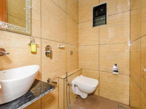 a bathroom with a toilet and a sink at Hotel Zillion Executive Near US Consulate Bandra Kurla Complex Mumbai Near Mumbai Airport Mumbai in Mumbai