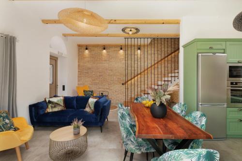 a living room with a blue couch and a table at Villa n.RICCIO in Sokrakion