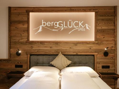 a bedroom with a bed and a picture on the wall at Holiday Home bergGlück by Interhome in Spiss
