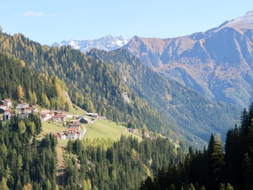 a village in a valley with mountains in the background at Holiday Home bergGlück by Interhome in Spiss