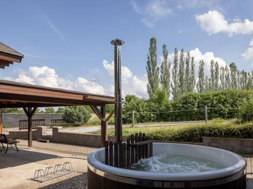 a water fountain in the middle of a patio at Holiday Home Pod Liščím Kopcem by Interhome in Horní Branná