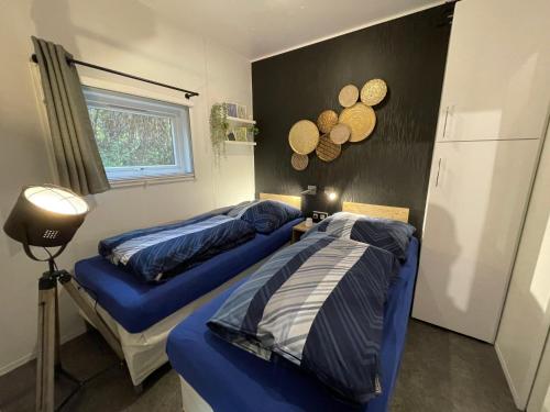 a bedroom with two beds and a window at Holiday Home Ulrike by Interhome in Wemding