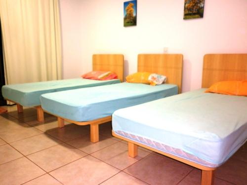 Кровать или кровати в номере Park Golf Hostel Ipelandia