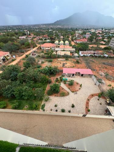 an aerial view of a small town with a building at Hillsview Apartment in Voi