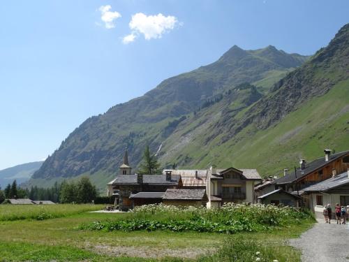 a village in the mountains with a mountain at Chalet Alpin Luxe, Jacuzzi, Vue in Champagny-en-Vanoise
