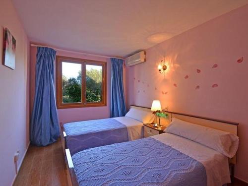 Ένα ή περισσότερα κρεβάτια σε δωμάτιο στο Villa Benestar by Interhome