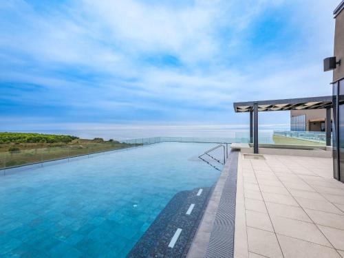 a swimming pool on the roof of a building at Holiday Home Semi-detached Villa Crveni vrh 1-2-3- by Interhome in Savudrija