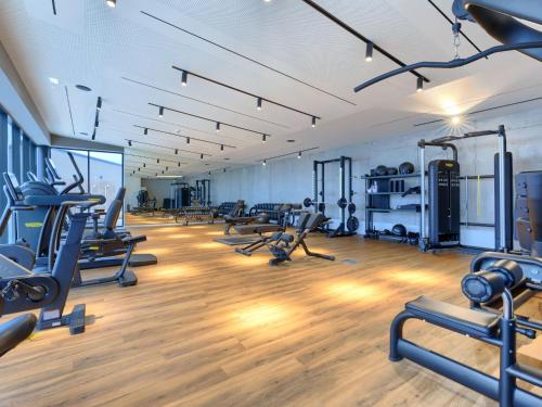 a gym with treadmills and elliptical machines at Holiday Home Semi-detached Villa Crveni vrh 1-2-3- by Interhome in Savudrija