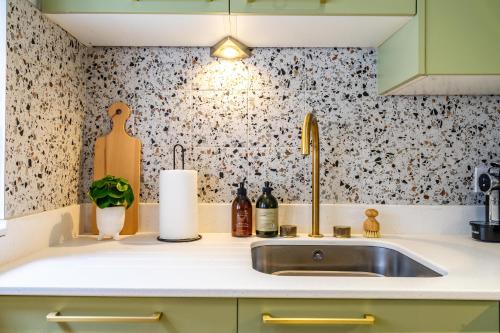 a kitchen counter with a sink in a kitchen at 17 Trinity Lane in York