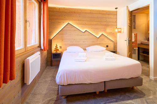 Ένα ή περισσότερα κρεβάτια σε δωμάτιο στο Hotel Base Camp Lodge - Les 2 Alpes