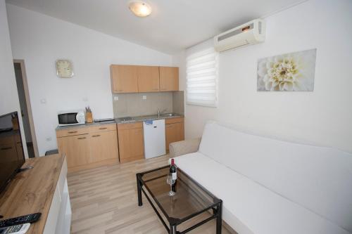Kuchyň nebo kuchyňský kout v ubytování Apartmani Vesna