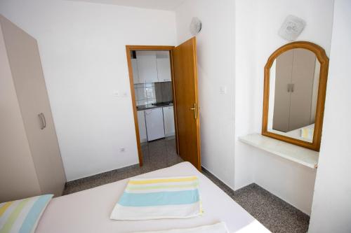 Postel nebo postele na pokoji v ubytování Apartmani Vesna