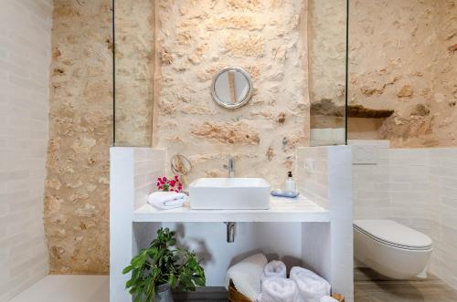 a bathroom with a sink and a toilet at Cal Tio 1 Agroturismo YourHouse in Costitx