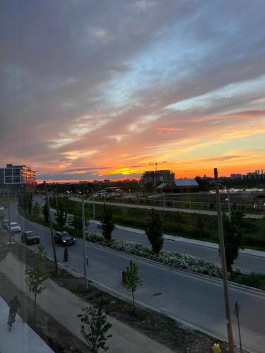 a view of a highway with a sunset in the background at King Bed TV Private Ensuite Retreat Bathroom or Economical Double Bed Room in Toronto