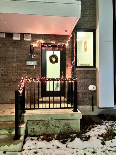 a front door of a house with christmas lights at King Bed TV Private Ensuite Retreat Bathroom or Economical Double Bed Room in Toronto