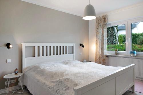 Ένα ή περισσότερα κρεβάτια σε δωμάτιο στο Apartment Dreiländer Blick