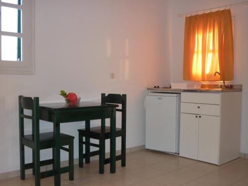 A kitchen or kitchenette at Manolis Farm Guest House