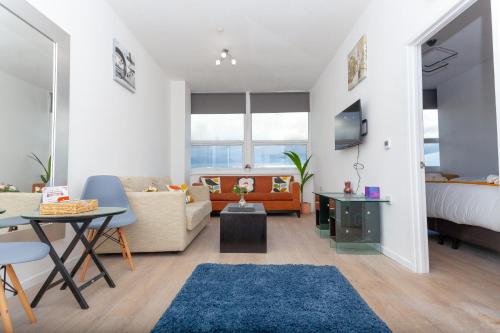 a living room with a bed and a couch at One Bedroom Serviced apartments Flat 311 in Birmingham