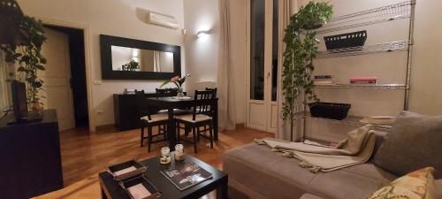 a living room with a couch and a table at Tacito Apartments in Terni