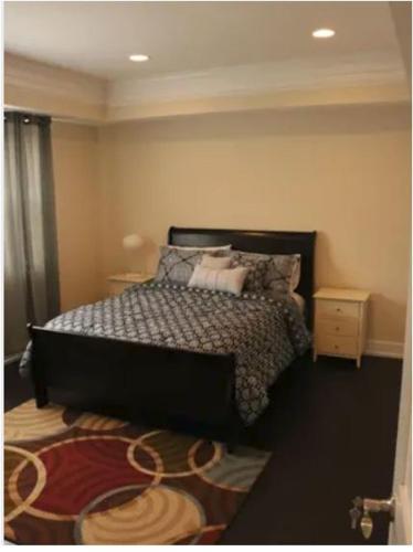a bedroom with a bed with pillows on it at Entire 3 bedroom Private Luxury Condo in Washington