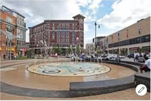 a fountain in the middle of a city with buildings at Entire 3 bedroom Private Luxury Condo in Washington