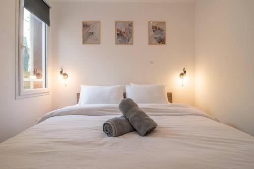 Postel nebo postele na pokoji v ubytování F2 hypercentre - Proche gare - WIFI gratuite