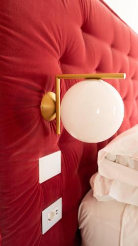a red stuffed teddy bear with a light on it at Palazzo Martinelli in Sorrento