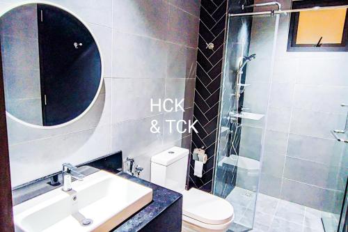 a bathroom with a sink and a toilet and a shower at Next2Mall at Sunway Velocity Two by HCK in Kuala Lumpur
