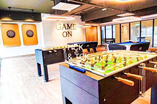 a game room with a giant foos ball on a table at Next2Mall at Sunway Velocity Two by HCK in Kuala Lumpur