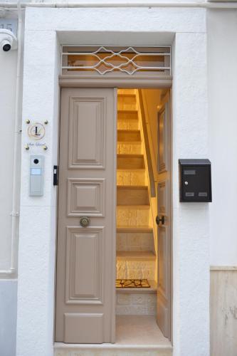 a door leading into a hallway with stairs at Suite Laurel SPA con idromassaggio in Fasano