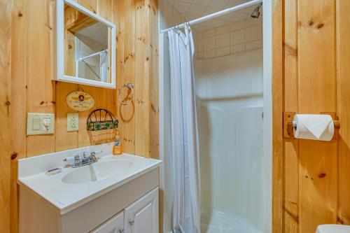 a bathroom with a white sink and a shower at Secluded Wilmington Retreat about 4 Mi to Mount Snow in Wilmington