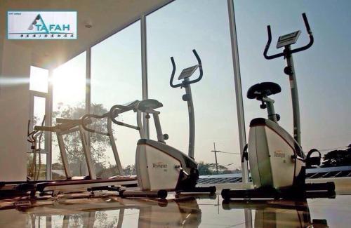 a group of exercise bikes in a gym at ตาฟ้าเรสซิเดนซ์ (Tafah Residence) in Sakon Nakhon